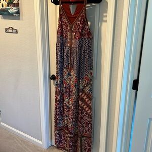 Extraordinary Anthropology jumpsuit with embellishments and wide legs. Size 12.